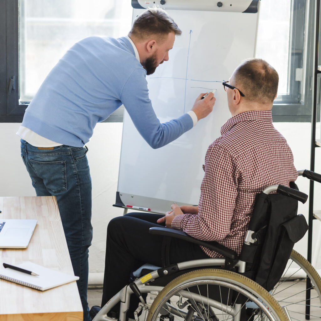 manager-presenting-project-disabled-worker
